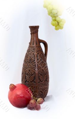Still-life with a bottle and pomegranate