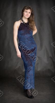 The girl in a dark blue evening dress