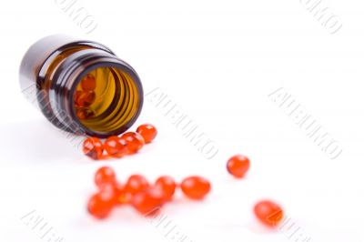 bottle with red pills