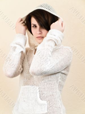young woman in white hood