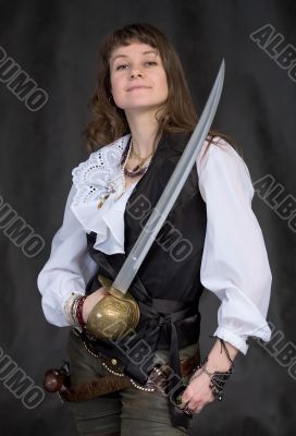 The girl - pirate with a sabre in hands
