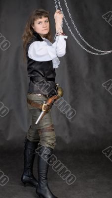 The girl - pirate with a sabre in hands