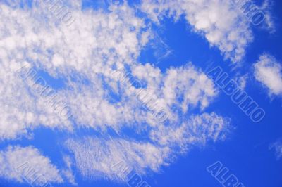 white clouds on the blue sky