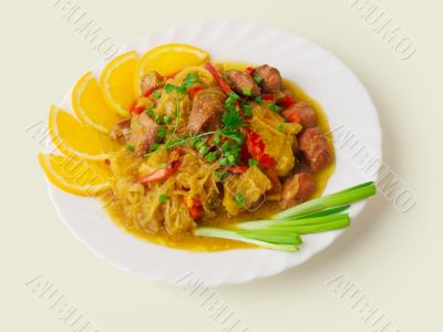 Meat goulash with cabbage, orange, pepper...