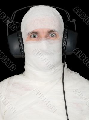 Man in bandage with ear-phones
