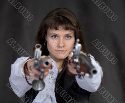 Girl - pirate with two ancient pistols in hands