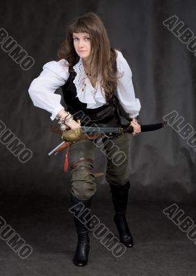 The girl - pirate with a sabre in hands