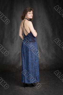 The girl in a dark blue evening dress