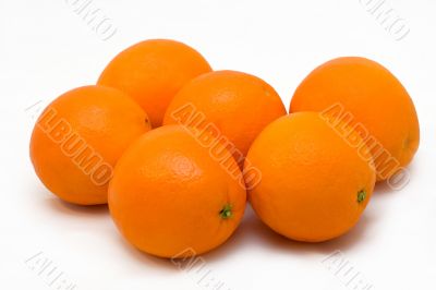 Some oranges on a white background.