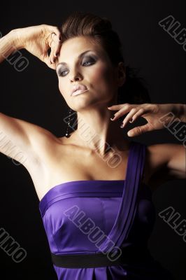brunette fashion girl in violet dress