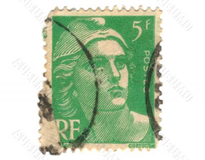 Old green french stamp with woman head