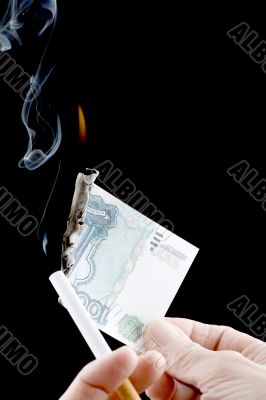 burning money and cigarette
