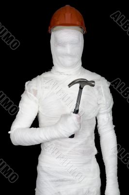 Laborer in bandages with helmet and hammer
