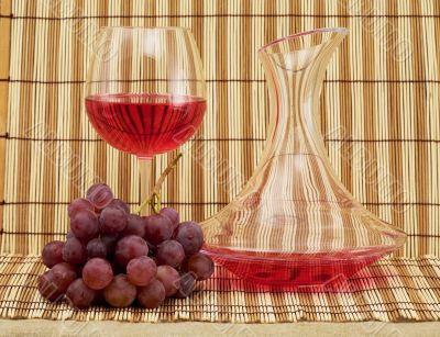 Still life with decanter, goblet and grapes