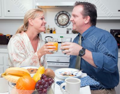 Happy Attractive Couple In Kitchen