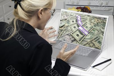 Excited Woman In Kitchen Using Laptop - Success