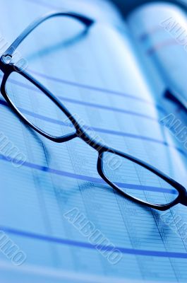 glasses on newspaper page