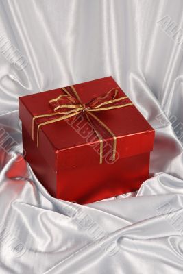 red gift box on white satin