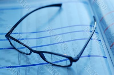 glasses on newspaper page