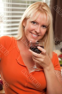 Attractive Blond with a Glass of Wine