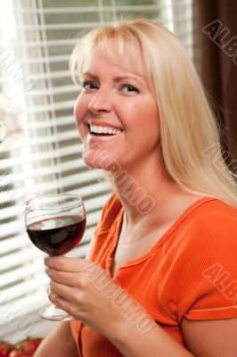 Attractive Blond with a Glass of Wine