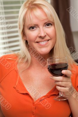 Attractive Blond with a Glass of Wine