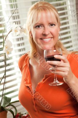 Attractive Blond with a Glass of Wine