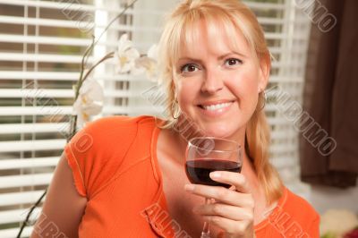 Attractive Blond with a Glass of Wine