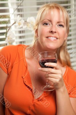 Attractive Blond with a Glass of Wine