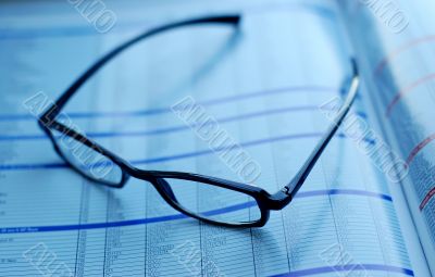 glasses on newspaper page