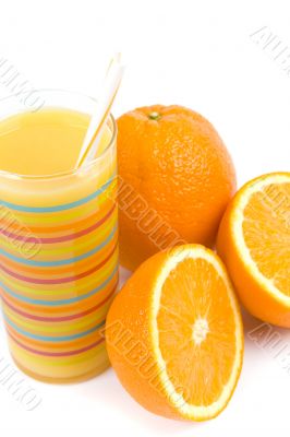 glass of juice and oranges