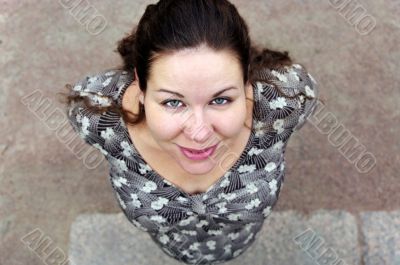 Pregnant woman looks up.
