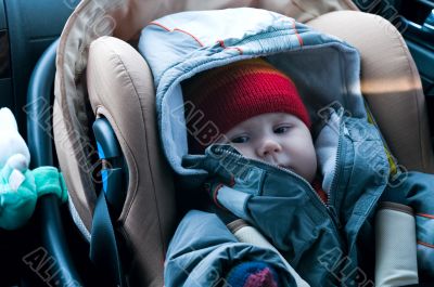 Child in safety car seat