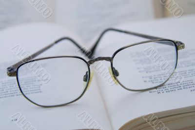 Glasses on the book