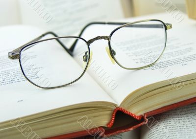 Books and Glasses on it