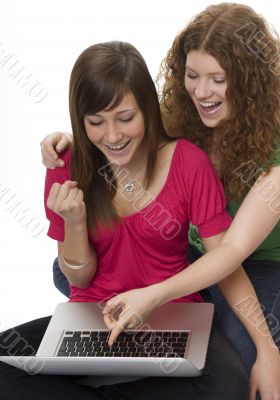 Two teenagers with laptop computer