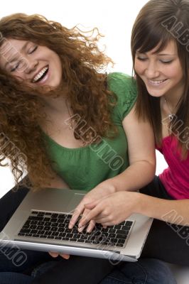 Two teenagers with laptop computer