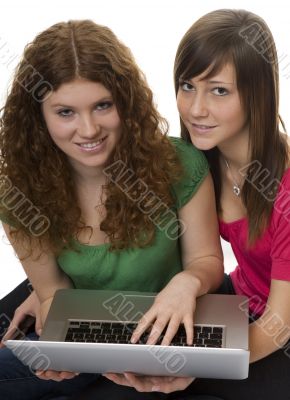 Two teenagers with laptop computer