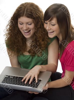 Two teenagers with laptop computer