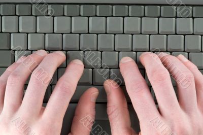 Male fingers on keyboard