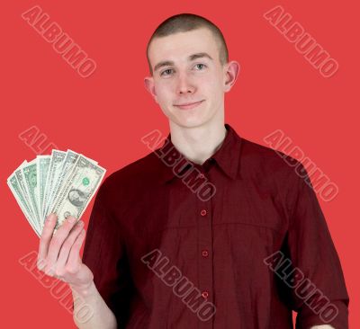 Young man with pack of dollars