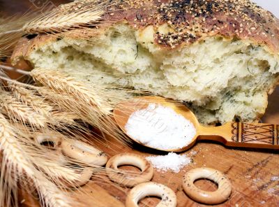 Loaf of bread with a spoonful of salt