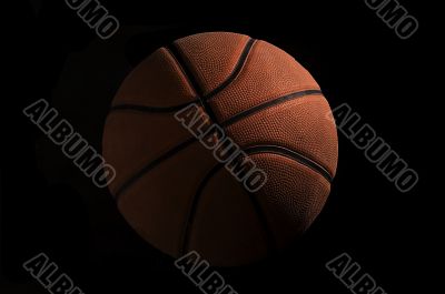 Basketball over black background