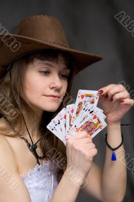 Portrait girl with a playing-cards