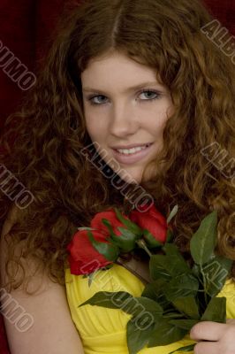 red haired teenager with red roses