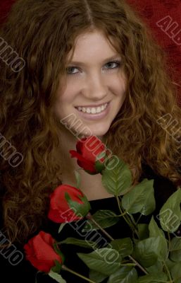 red haired teenager with red roses