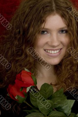 red haired teenager with red roses