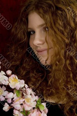 red haired teenager with cherry blossoms