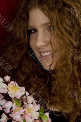 red haired teenager with cherry blossoms