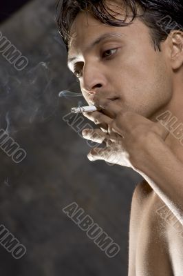 intensively smoking man